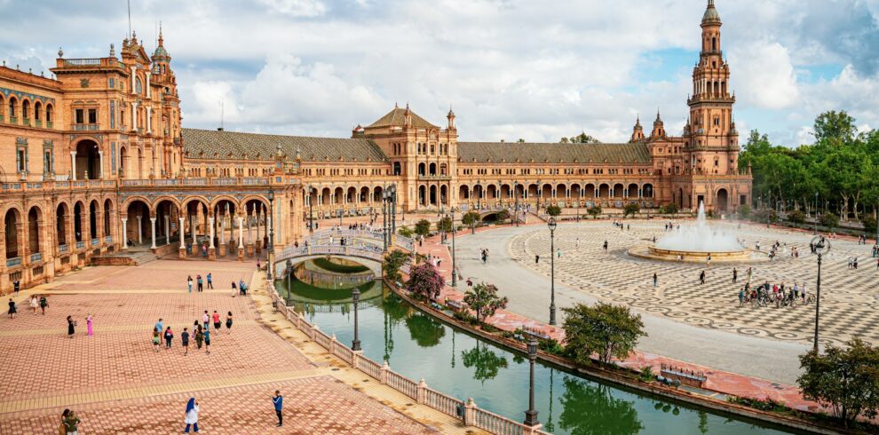 a large building with a fountain in front of it